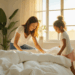 Pessoa arrumando a cama de manhã com luz natural, simbolizando o início de uma rotina matinal de organização da casa.